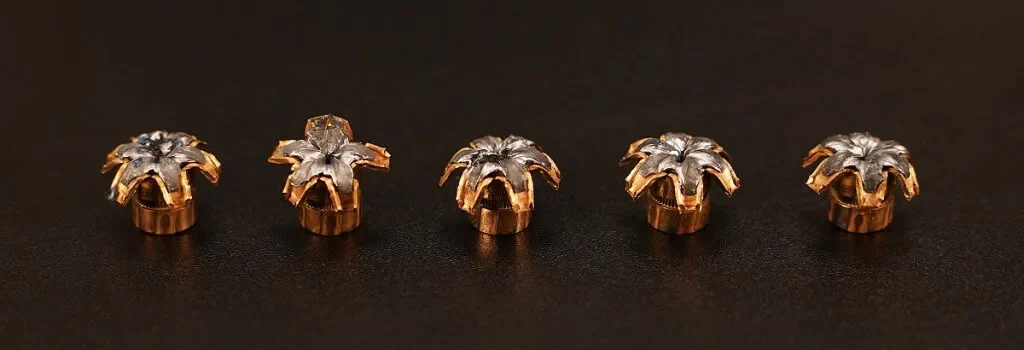 five expanded 9mm hollow point bullets on display